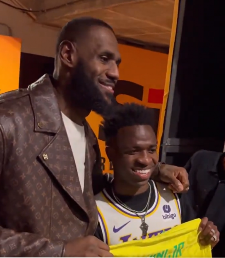 Vinicius Junior presents LeBron James during the NBA Christmas round