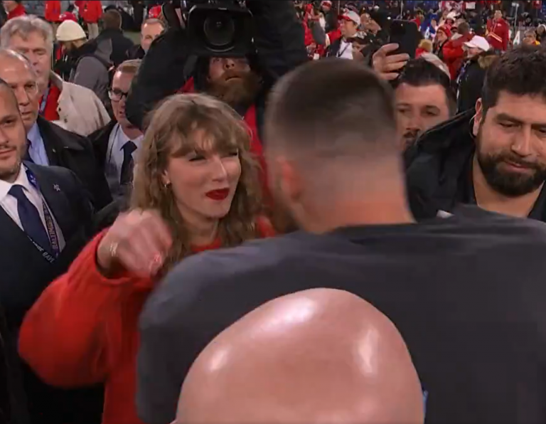 Taylor Swift appears on the NFL field to celebrate her boyfriend Travis Kelce winning the title